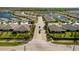 Aerial view of a serene community with homes surrounding tranquil lakes and lush landscaping at 25292 E Lenox Cir, Punta Gorda, FL 33950