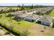 Aerial view of homes showcasing backyard views and manicured lawns in a desirable neighborhood at 25292 E Lenox Cir, Punta Gorda, FL 33950