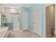 Bright bathroom featuring a walk-in shower, a vanity with modern fixtures, and neutral tones at 25292 E Lenox Cir, Punta Gorda, FL 33950