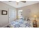 Comfortable bedroom with natural light from the window and a cozy quilt at 25292 E Lenox Cir, Punta Gorda, FL 33950