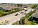 Aerial shot of a gated community entrance featuring lush landscaping and well maintained neighborhood at 25292 E Lenox Cir, Punta Gorda, FL 33950