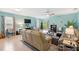Spacious living room with comfortable seating, ceiling fan, and view to the exterior at 25292 E Lenox Cir, Punta Gorda, FL 33950