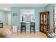 Living Room leading to the dining room and featuring a decorative curio cabinet at 25292 E Lenox Cir, Punta Gorda, FL 33950