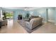 Spacious living room with access to a screened lanai and stylish furniture at 25292 E Lenox Cir, Punta Gorda, FL 33950