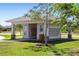 Neighborhood mail kiosk with covered structure and multiple mailboxes on a sunny day at 25292 E Lenox Cir, Punta Gorda, FL 33950