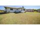 Spacious backyard with lush green grass and manicured shrubbery at 3753 Aba Ln, North Port, FL 34287