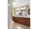 Elegant bathroom featuring double sinks, granite counters, and modern fixtures at 3753 Aba Ln, North Port, FL 34287