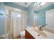 Bright bathroom with shower-tub, vanity with sink, and neutral wall color at 3753 Aba Ln, North Port, FL 34287