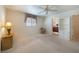 Well-lit bedroom with white walls, neutral carpet, and a window with decorative valance at 3753 Aba Ln, North Port, FL 34287