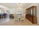 Elegant dining area with chandelier lighting that adjoins the living room, with easy access to kitchen at 3753 Aba Ln, North Port, FL 34287