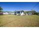 Well maintained lawn with lovely shrubbery surrounding the exterior of the home at 3753 Aba Ln, North Port, FL 34287