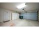 Spacious two car garage with white storage cabinets for organization and added storage at 3753 Aba Ln, North Port, FL 34287