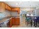 Well-lit eat-in kitchen area boasting stainless steel appliances and a window that provides natural light and views at 3753 Aba Ln, North Port, FL 34287