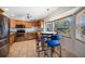 Spacious kitchen with stainless steel appliances, wood cabinets, and an eat-in area at 3753 Aba Ln, North Port, FL 34287