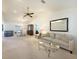 Open-concept living space featuring neutral tones, vaulted ceiling, and seamlessly connects the living, dining, and entertaining areas at 3753 Aba Ln, North Port, FL 34287