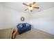 Cozy living room with a blue loveseat and decorative accents at 3753 Aba Ln, North Port, FL 34287