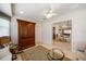 Charming living room with bright natural light, neutral colored tile flooring, and warm features at 3753 Aba Ln, North Port, FL 34287
