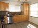Well-lit kitchen featuring granite countertops and modern stainless steel appliances at 409 Ricold Ter, Port Charlotte, FL 33954