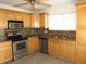 Modern kitchen with stainless steel appliances, granite countertops, and ample cabinet space at 409 Ricold Ter, Port Charlotte, FL 33954