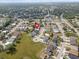Aerial view of the neighborhood featuring lush landscaping and nearby amenities at 478 Winwood Ct, Port Charlotte, FL 33954