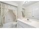 Bright bathroom with a shower-tub combo and white vanity at 478 Winwood Ct, Port Charlotte, FL 33954