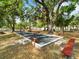 Bocce court, complete with benches, amidst a tranquil outdoor setting, perfect for community gatherings at 478 Winwood Ct, Port Charlotte, FL 33954