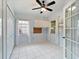 A spacious bonus room with white tile, bright natural light, and closet at 478 Winwood Ct, Port Charlotte, FL 33954
