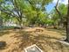 Community park features benches and recreational areas, surrounded by lush greenery and mature trees at 478 Winwood Ct, Port Charlotte, FL 33954