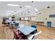 Spacious community room with tables, chairs, and ample natural light, perfect for gatherings and events at 478 Winwood Ct, Port Charlotte, FL 33954