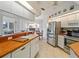 Well-equipped kitchen featuring stainless steel appliances and breakfast bar at 478 Winwood Ct, Port Charlotte, FL 33954