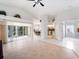 Expansive living space with sliding glass doors and neutral tiled flooring at 478 Winwood Ct, Port Charlotte, FL 33954