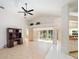 Spacious living room with vaulted ceilings, tiled floors, and natural light at 478 Winwood Ct, Port Charlotte, FL 33954