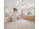 Spacious main bedroom features tile flooring, ceiling fan, and ample natural light at 478 Winwood Ct, Port Charlotte, FL 33954