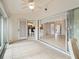 Covered outdoor seating area with sliding glass doors and tile flooring at 478 Winwood Ct, Port Charlotte, FL 33954