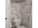 Bathroom with a tropical wallpaper at 5421 Holiday Park Blvd, North Port, FL 34287