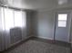 Neutral bedroom featuring a faux brick wall and modern flooring at 5421 Holiday Park Blvd, North Port, FL 34287