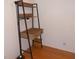Space-saving ladder desk with storage and industrial style complements a neutral-toned room at 5421 Holiday Park Blvd, North Port, FL 34287