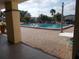 Community pool surrounded by a brick patio, offering a perfect spot for relaxation and recreation at 5421 Holiday Park Blvd, North Port, FL 34287
