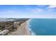 Expansive oceanfront views stretch along the sandy beach, showcasing the condo's desirable coastal location at 600 Sutton Pl # 101B, Longboat Key, FL 34228