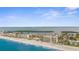 Stunning aerial view of beachfront condos with beach access, a swimming pool, and picturesque ocean views at 600 Sutton Pl # 101B, Longboat Key, FL 34228