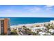 Beautiful aerial view of beachfront condo and expansive ocean shoreline at 600 Sutton Pl # 101B, Longboat Key, FL 34228