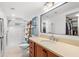 Full bathroom with walk-in shower, a vanity, and a closet at 600 Sutton Pl # 101B, Longboat Key, FL 34228