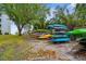 Community kayak storage area featuring a colorful assortment of kayaks near the waterfront at 600 Sutton Pl # 101B, Longboat Key, FL 34228