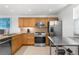 Modern kitchen features stainless steel appliances, granite countertops, and stylish cabinets, ideal for cooking enthusiasts at 600 Sutton Pl # 101B, Longboat Key, FL 34228
