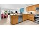 Well-equipped kitchen with stainless steel appliances, ample cabinetry, and a convenient breakfast bar at 600 Sutton Pl # 101B, Longboat Key, FL 34228