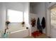 Bright bathroom featuring a soaking tub under a window and a separate shower with floral accents at 7882 Dulce Ave, North Port, FL 34287
