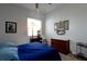 Bright bedroom showcases a dresser and side table, complemented by neutral walls and carpeted flooring at 7882 Dulce Ave, North Port, FL 34287