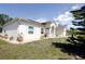 Beautiful home featuring solar panels and well-manicured landscaping at 7882 Dulce Ave, North Port, FL 34287