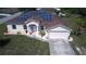 Charming home with a well-manicured lawn and solar panels at 7882 Dulce Ave, North Port, FL 34287