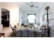 Bright and airy living room with floral sofas and a view into other areas at 7882 Dulce Ave, North Port, FL 34287